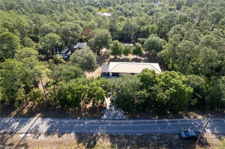 Drone / aerial view featuring a view of trees