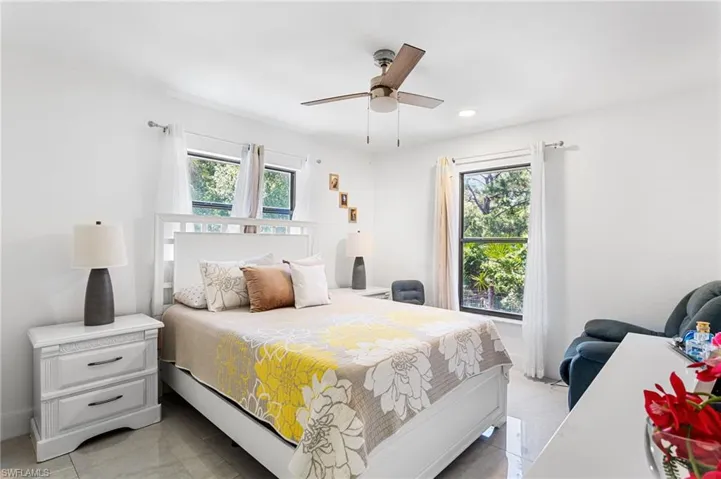 Bedroom with recessed lighting and ceiling fan