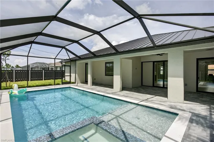 Enjoy a HEATED POOL & SPA designed for YEAR-ROUND SWFL outdoor living!