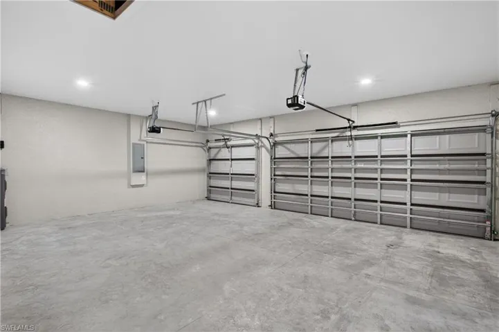 OVERSIZED 3-CAR GARAGE provides extra space for vehicles, storage & convenience!