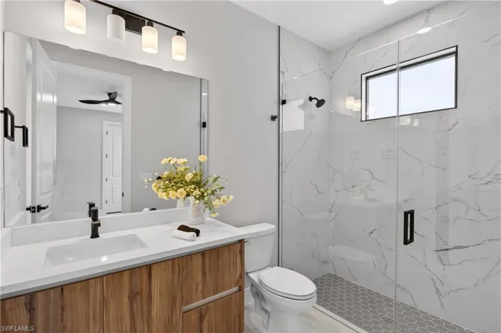 Convenient POOL BATHROOM provides easy access to outdoor entertaining areas.
