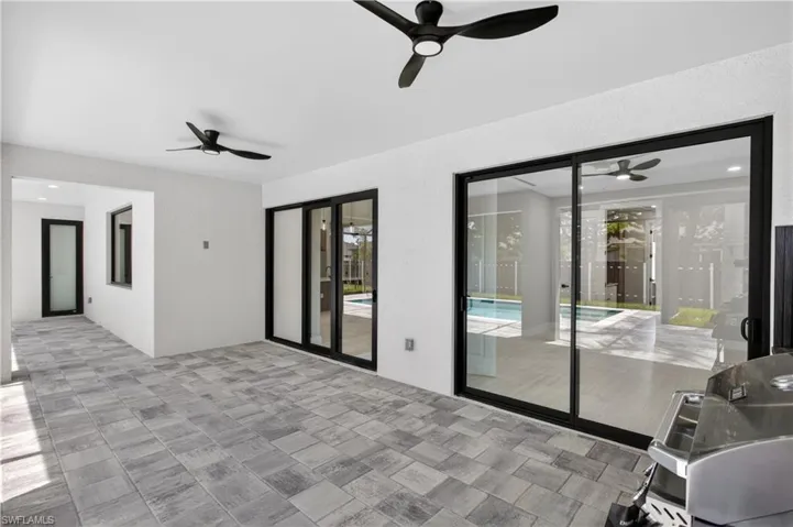 PAVER FLOORING & CEILING FAN create COMFORTABLE SPACE for YEAR-ROUND ENJOYMENT.