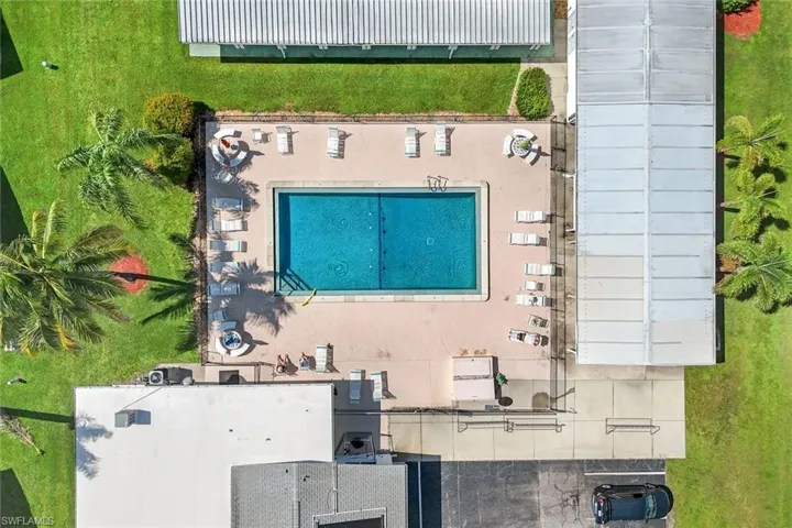 View of subject property featuring a pool