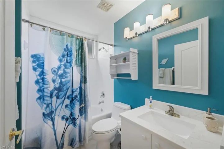 Full bathroom featuring vanity and shower / bath combo