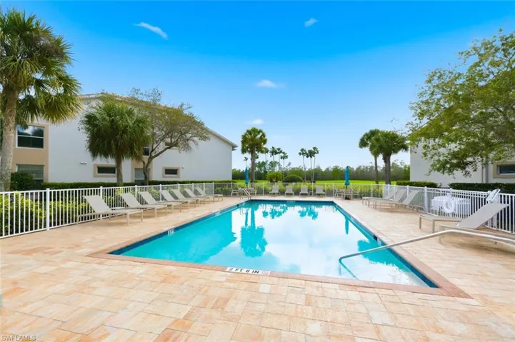 Community pool featuring a patio