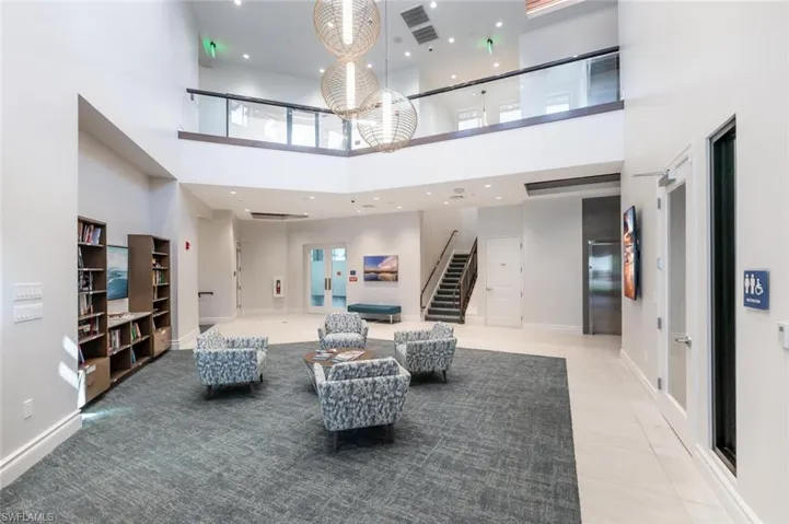 Common area featuring recessed lighting and a high ceiling