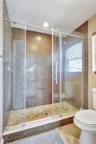 primary bathroom showing the walk in shower