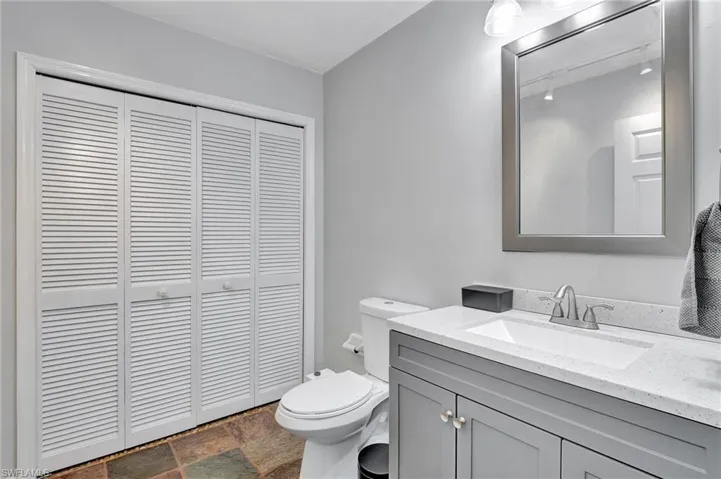 Half bath downstairs with laundry closet