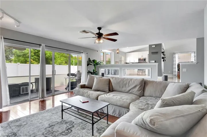 The second living area opens to the screened lanai and fenced backyard