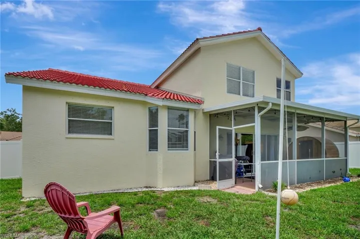 Screened lanai with spacious backyard