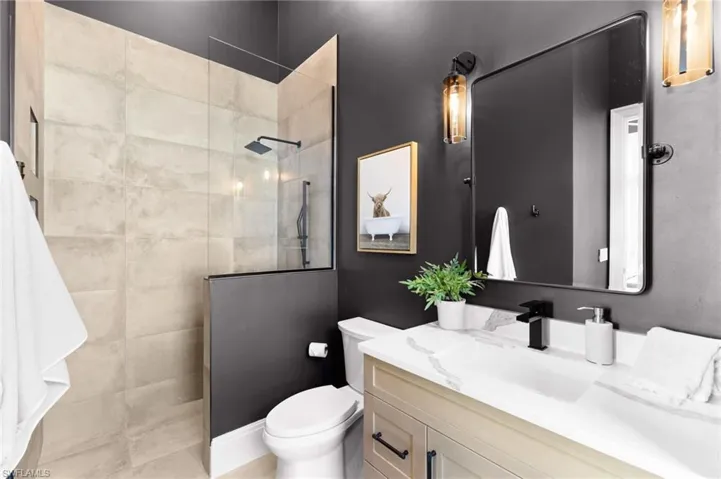 Full bath featuring vanity and walk in shower