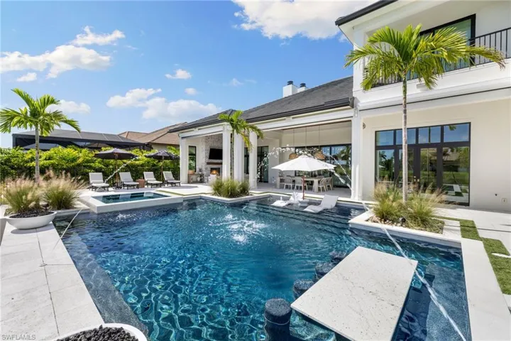 Integrated pool / spa featuring a patio and outdoor dining area