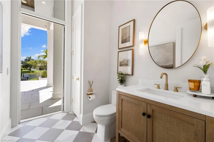 Full bath featuring vanity and light flooring