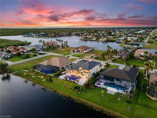 Aerial perspective of suburban area with a large body of water