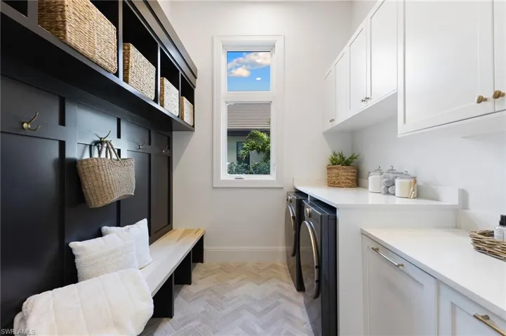 Laundry room featuring cabinet space and washer and dryer