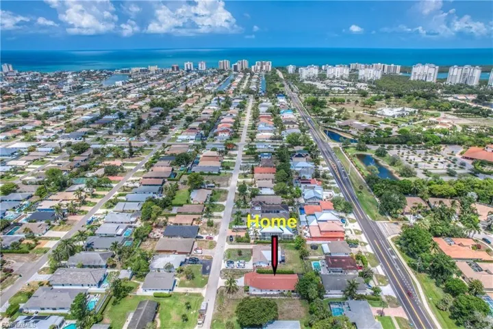 Aerial view of property's location featuring close proximity to World Famous Vanderbilt Beach
