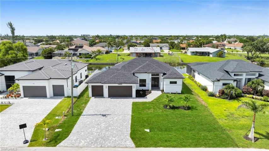 Aerial perspective of suburban area with a large body of water