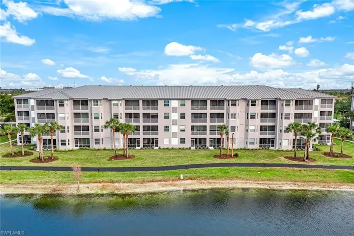 View of property with a water view