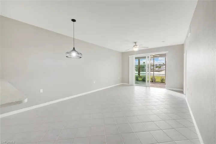 Tiled empty room with ceiling fan