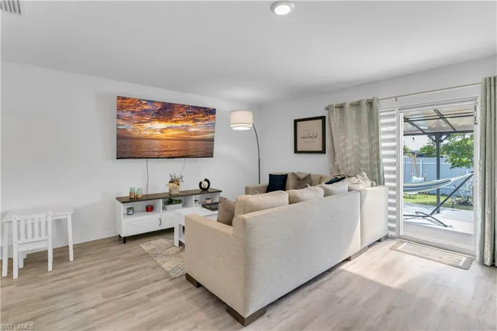 Living room with light hardwood / wood-style floors