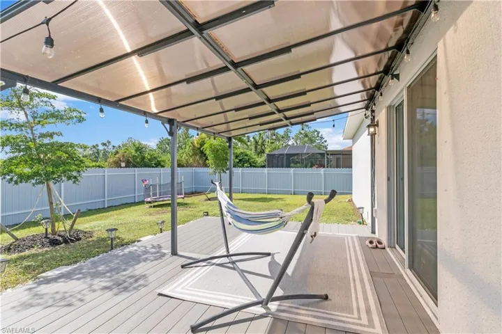 Wooden terrace with a lawn