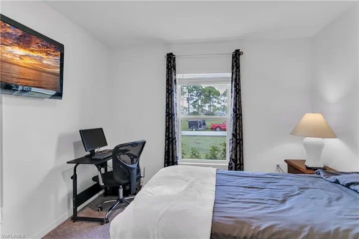 Bedroom featuring carpet flooring