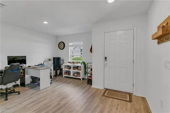 Office space featuring light wood-type flooring