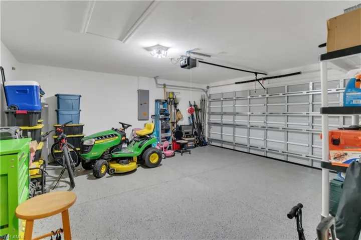 Garage with a garage door opener and electric panel