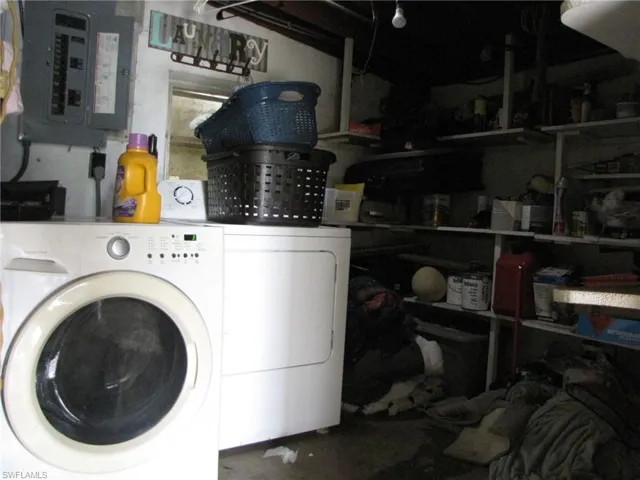 Clothes washing area with electric panel and washing machine and clothes dryer