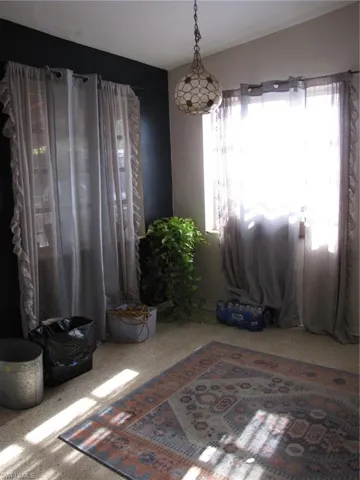 Unfurnished room with carpet