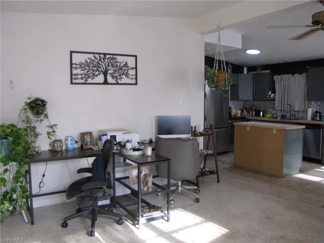 Office space featuring sink and ceiling fan