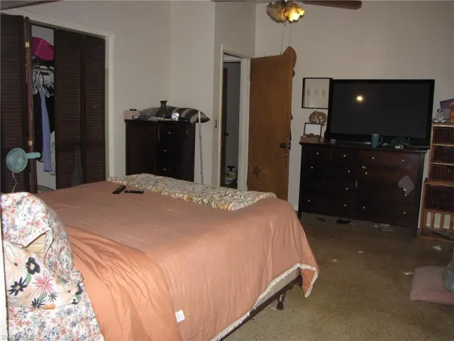 Bedroom featuring a closet, carpet flooring, and ceiling fan