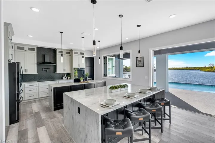 Double Island Kitchen with seating for 8 and storage cabinets and drawers