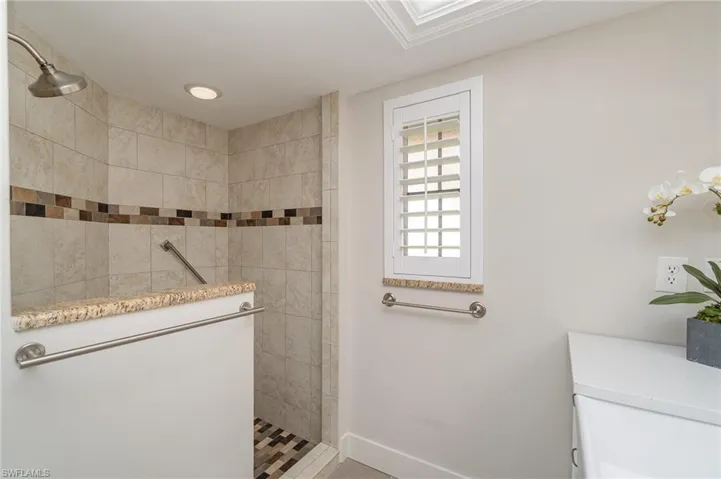 Bathroom with tiled shower