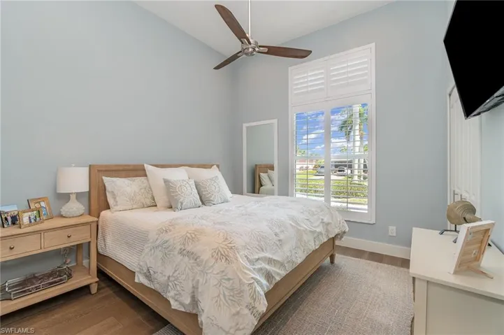 Bedroom featuring light hardwood / wood-style floors and ceiling fan