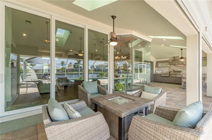 Lanai featuring a water view and fire table