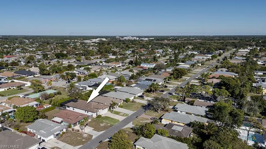 Aerial overview of property's location featuring nearby suburban area