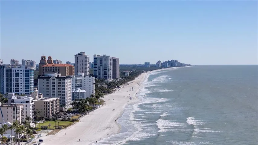 Water view featuring city skyline and nearby beach