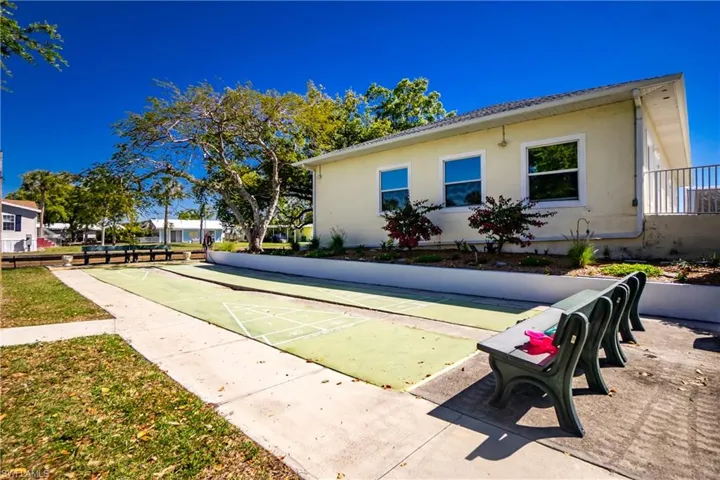 View of home's community with shuffleboard