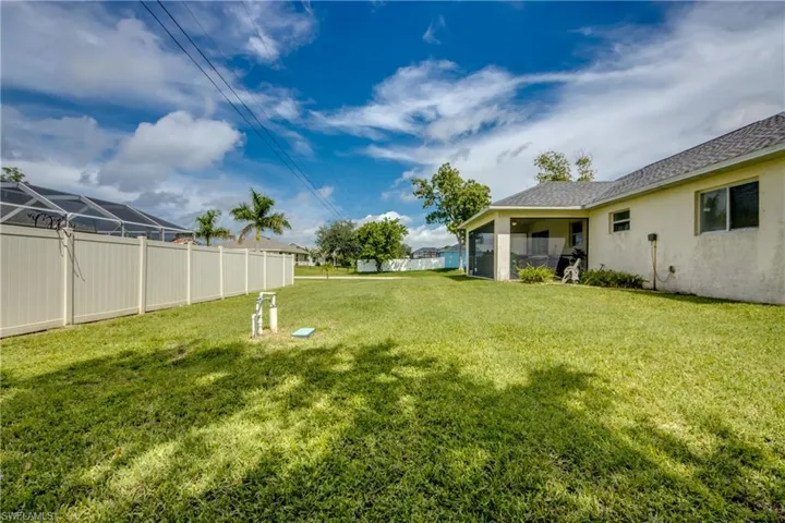 View of yard with a sunroom