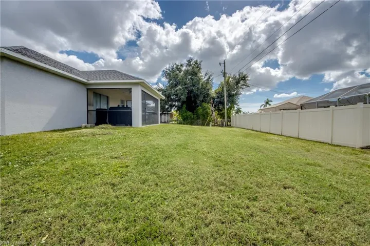 View of yard featuring a sunroom