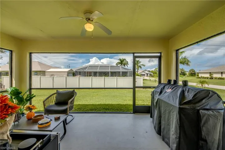 Sunroom featuring ceiling fan
