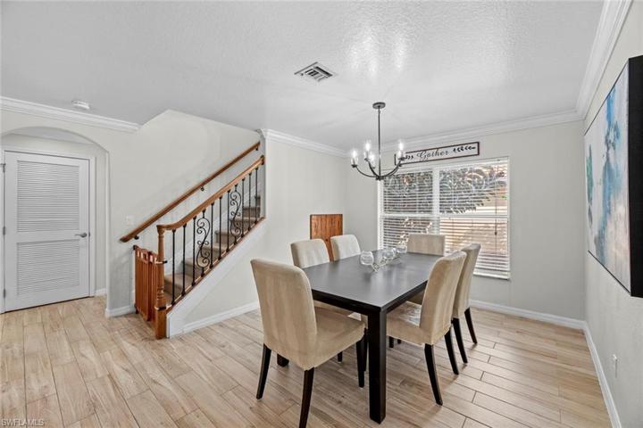 Formal dining next to stairway to 2nd level