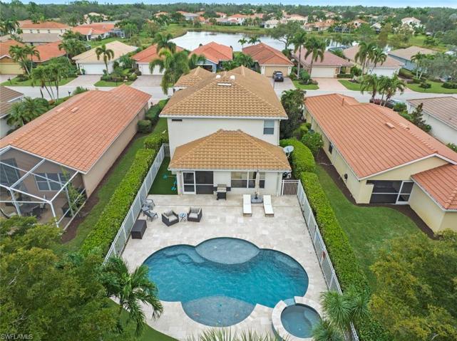 Aerial view of rear of home and pool