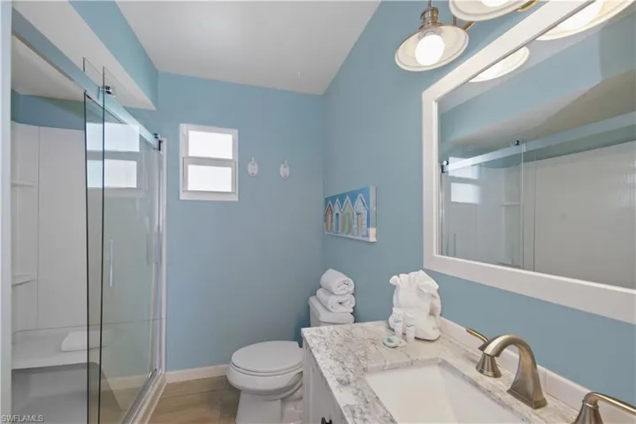 Master Bathroom: Well-maintained bathroom with a glass-enclosed shower - Virtually Edited Image