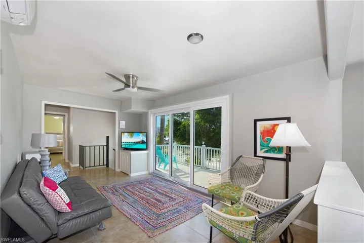 Spacious living area with ample natural light - Virtually Edited Image
