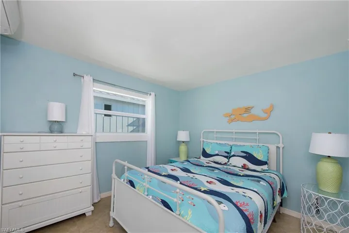 Comfortable guest bedroom with ample storage - Virtually Edited Image