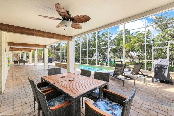 Sunroom featuring ceiling fan