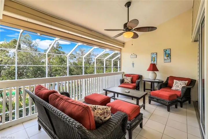 Sunroom featuring ceiling fan