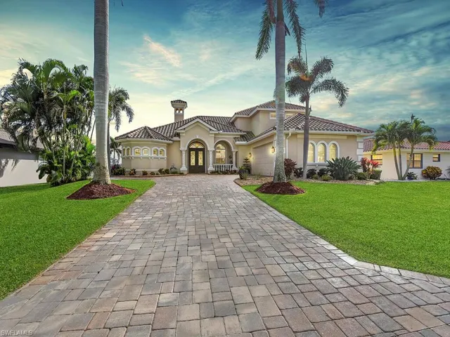 Florida Style Custom Home in Palaco Grande with lush landscaping